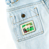 Vintage Levi's "Protect the Rainforest" White Tab light wash cinch waist denim adventure shorts · Size 4T+