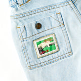 Vintage Levi's "Protect the Rainforest" White Tab light wash cinch waist denim adventure shorts · Size 4T+